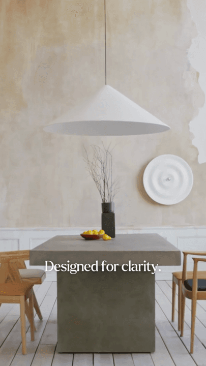 A pared-back dining room interior with the caption Designed for clarity