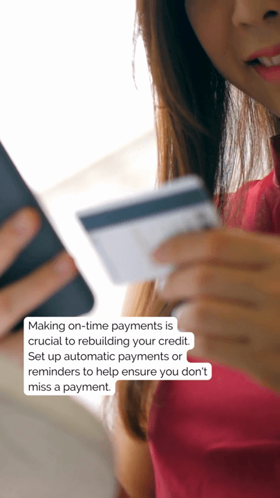 Someone holding a credit card with advice about on-time payments